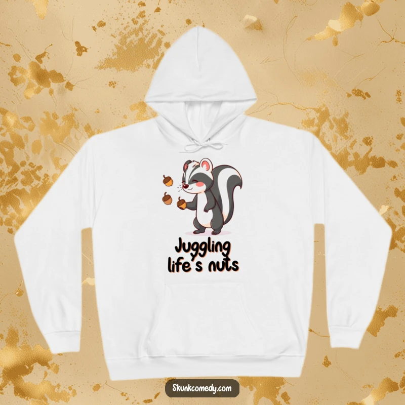 A cozy hoodie featuring a funny skunk expertly juggling three acorns, bringing playful energy and warmth.