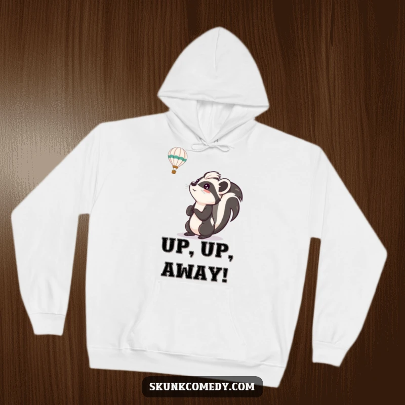 Funny skunk hoodie featuring a skunk looking up with excitement at a hot air balloon, a cozy and inspirational piece of clothing.