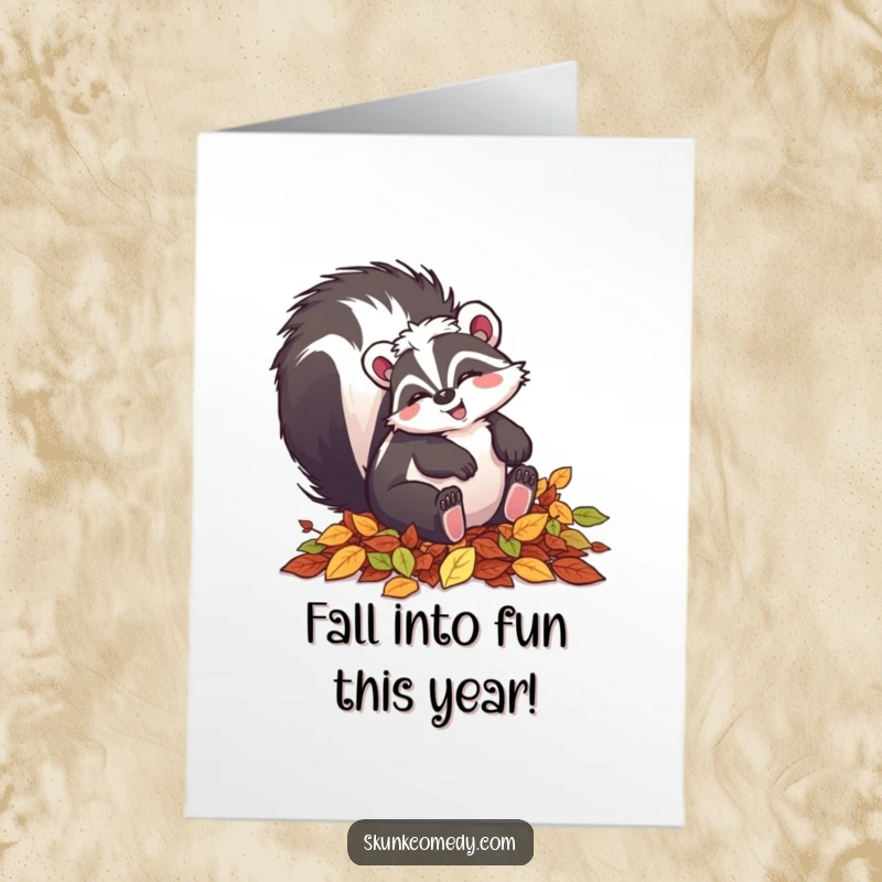 Funny Free Printable Birthday Card: A skunk with a smile playfully tumbling in a pile of colorful autumn leaves, enjoying the season.
