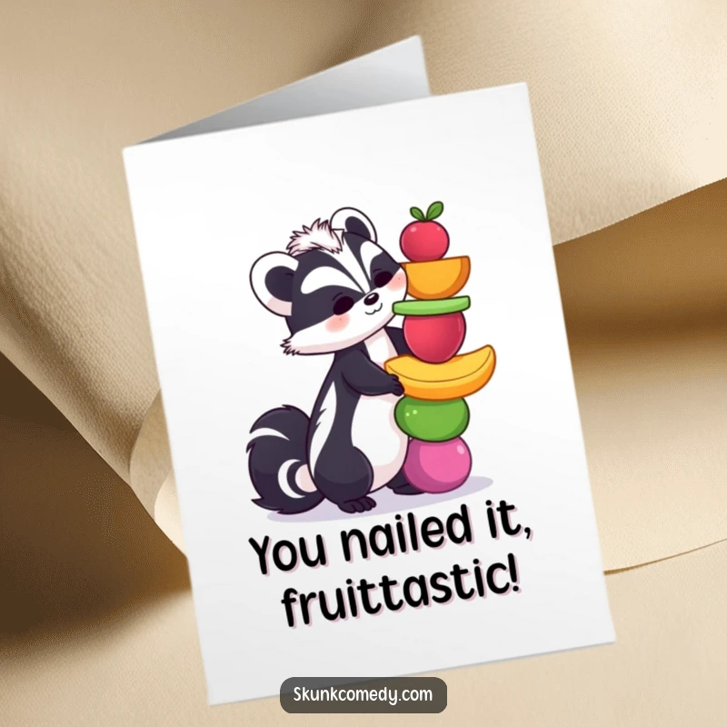Funny free printable congratulations card featuring a skunk attempting to balance a tall stack of vibrant fruits.
